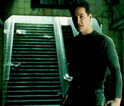 a man is standing in front of a set of stairs and a sign that says 83 35 st