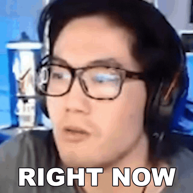 a man wearing glasses and headphones has the words right now written on his face