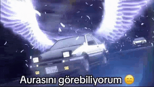 a car with wings is driving down a road in a dark room .