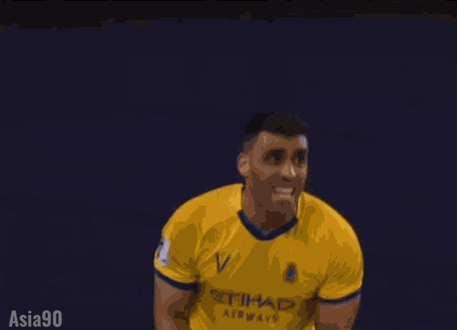 a soccer player in a yellow jersey with the number 8 on it