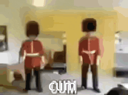 a blurry picture of two guards with the word cum in the bottom right corner