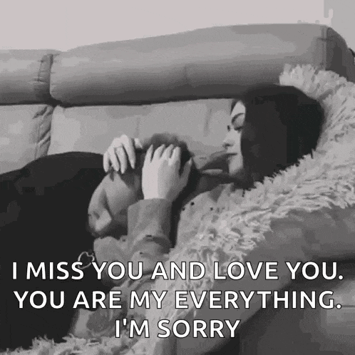 a black and white photo of a woman laying on a couch holding a puppy and a quote .