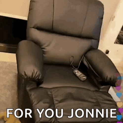 a black recliner with the words " for you jonnie " on the bottom