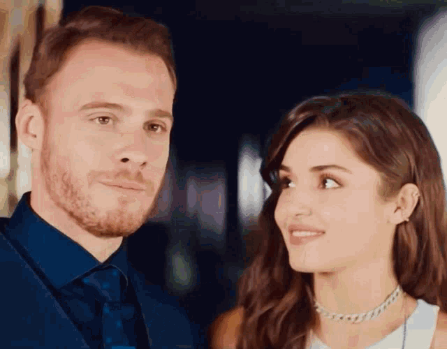 a man and a woman looking at each other