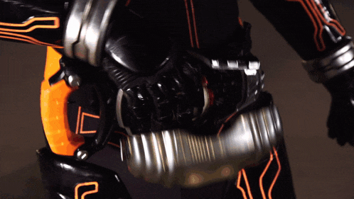 a close up of a person wearing a black and orange suit with a l on it