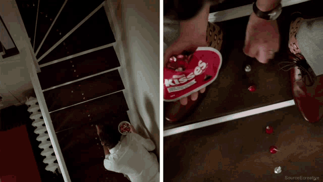 a person holding a box of kisses candy on a staircase