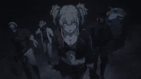 a group of people are standing in a dark room with a woman standing in the middle .