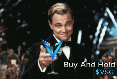 a man in a tuxedo holds a glass in front of a buy and hold sign