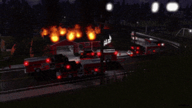 several fire trucks are parked in front of a fire