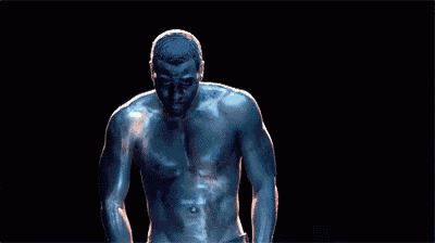 a close up of a man 's torso with a light shining on it