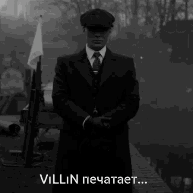 a black and white photo of a man in a suit and tie with the words " villain " written in white