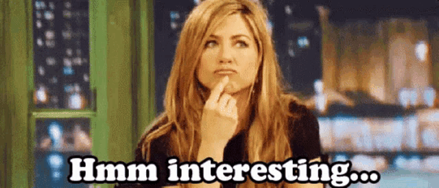 a woman with a finger on her chin says hmm interesting