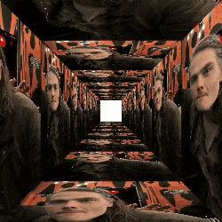 a man 's head is visible in the middle of a tunnel of faces