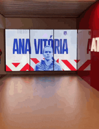 a large screen with ana vitoria written in blue on it