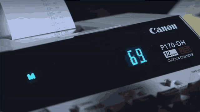 a canon p170-dh clock and calendar has 4:20 on the screen