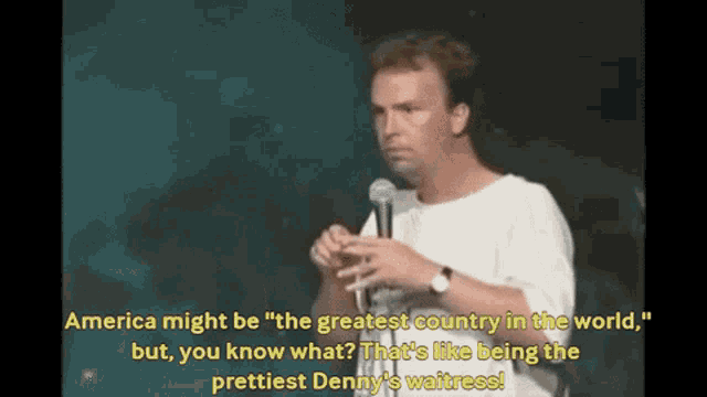 a man stands in front of a microphone and says " america might be " the greatest country in the world "