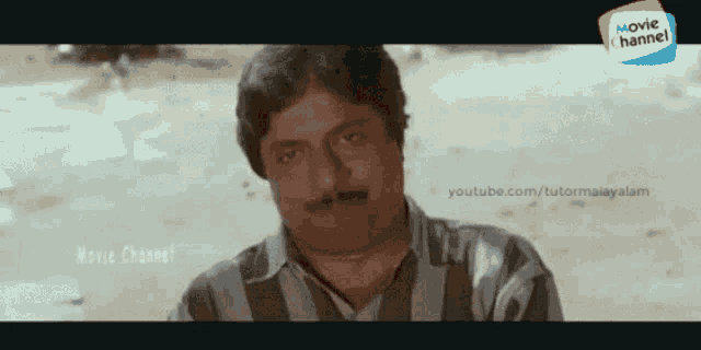 a man with a mustache is shown in a movie channel ad