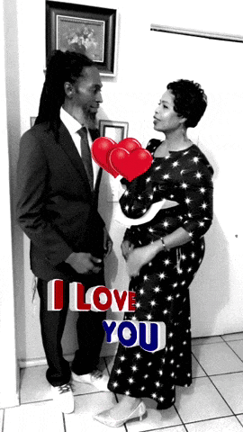 a man in a suit and tie stands next to a woman in a black and white dress