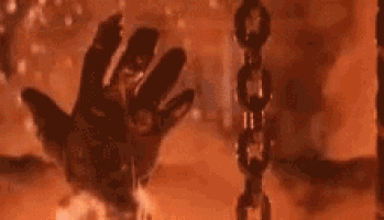 a close up of a chain with smoke coming out of it and a person 's head in the background .
