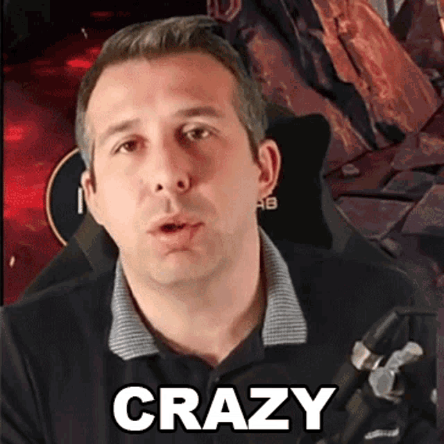 a man in a black shirt with the word crazy on his chest