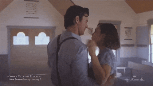 a man and woman are dancing in a hallmark advertisement