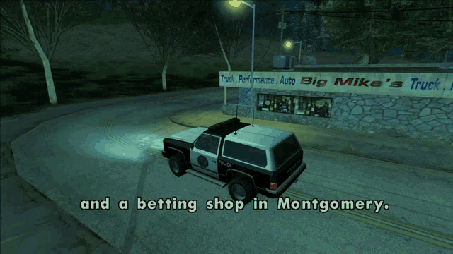 a police car is parked in front of a truck performance auto big shop