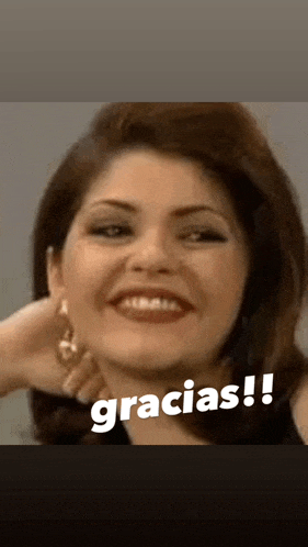 a close up of a woman 's face with the words gracias written on the bottom .
