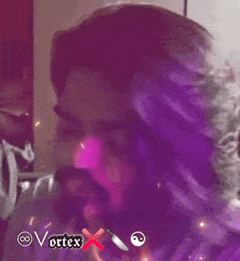 a man with purple hair and a beard has the word vortex above him