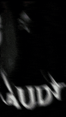 a black and white photo of a girl with the name audy on the bottom