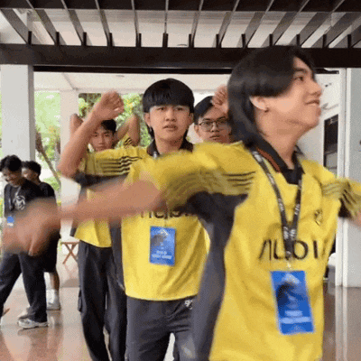 a group of young men are wearing yellow shirts with the word audi on the front