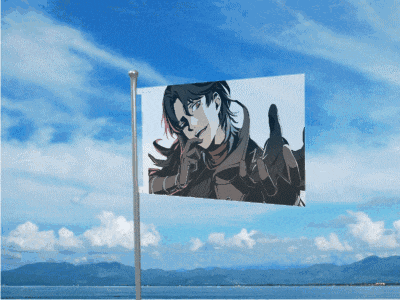 a flag with a picture of a man on it flying in the wind
