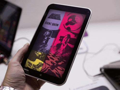 a person is holding a tablet that says event show
