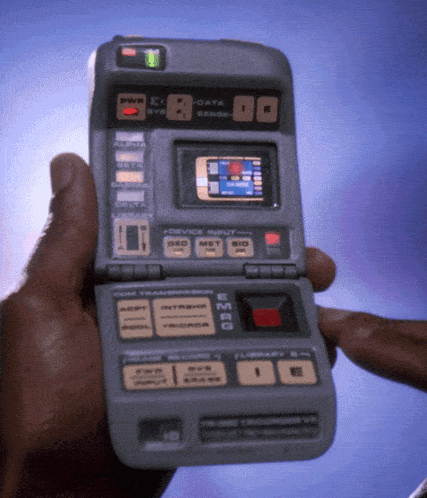 a person is holding a device that has the word emrg on the front