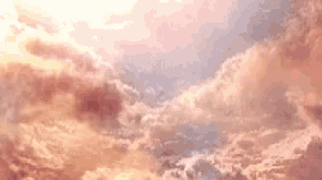 a cloudy sky with the sun shining through the clouds