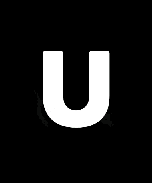the letter u is glowing in the dark with a black background