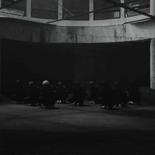 a black and white photo of a group of people