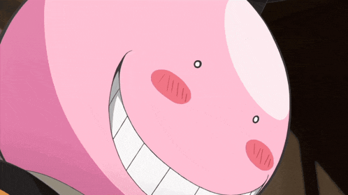 a close up of a pink cartoon character with a smile on his face