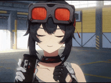 a girl wearing goggles is holding a cellphone