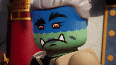a close up of a lego character with blue and green face paint