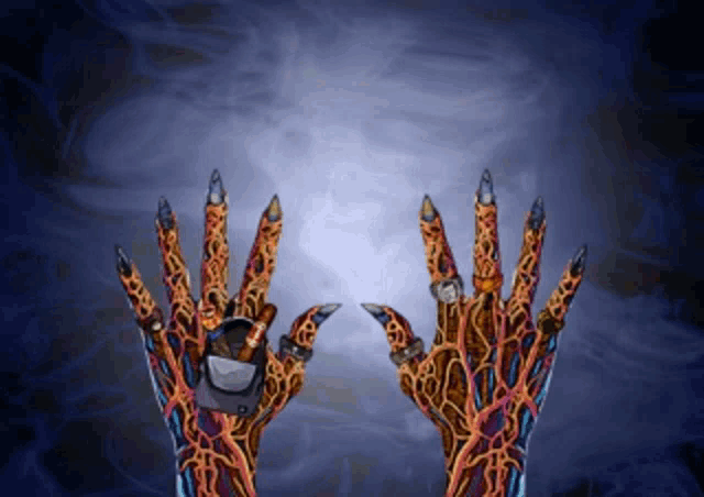 a pair of hands with sharp claws holding something in their hands
