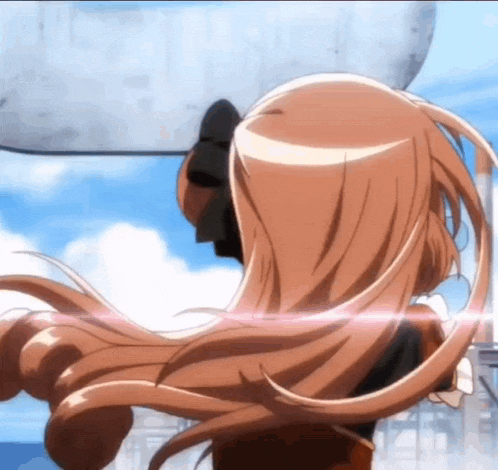 a girl with long hair is standing in front of a building
