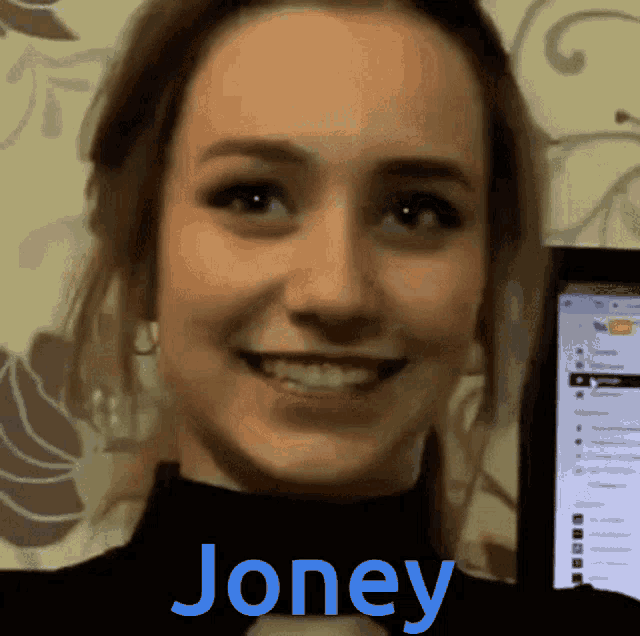 a smiling woman with the name joney on the bottom of her face