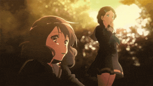 two anime girls are standing next to each other in a forest