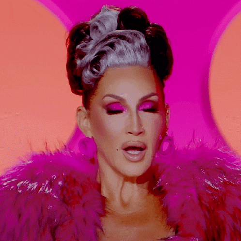 a woman wearing a pink fur coat and pink eyeshadow