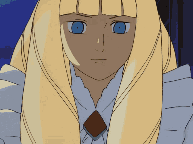a girl with long blonde hair and blue eyes looks at the camera