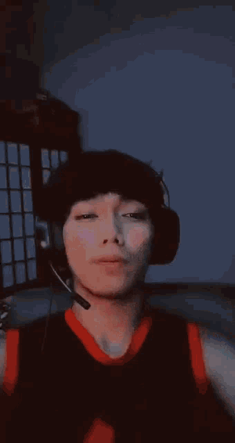 a close up of a person wearing headphones and a microphone on their head .