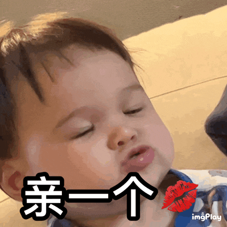 a baby with chinese writing on his face and a red lip