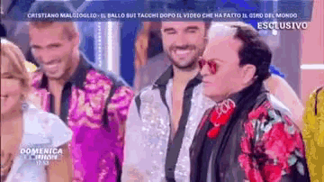 a group of people are posing for a picture on a television show called domenica