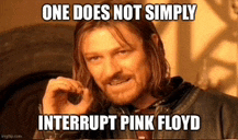 a man with a beard is making a funny face with the words one does not simply interrupt pink floyd .