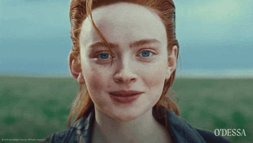 a close up of a woman 's face with odessa written on the bottom right